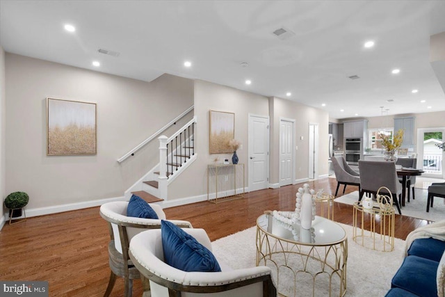 5521 4th St NW, Washington, DC 20011 - living area with wood finished floors, recessed lighting, stairway, and baseboards