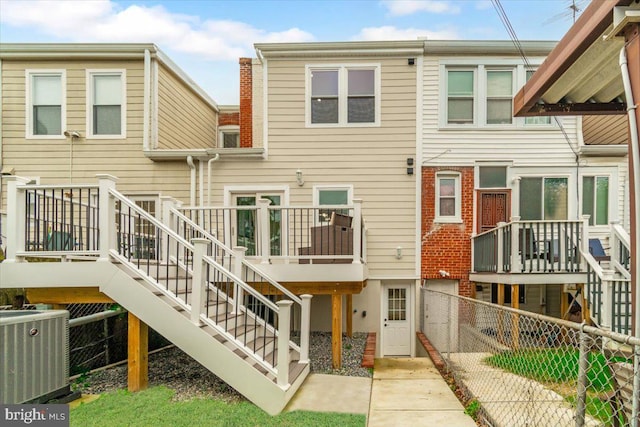 5521 4th St NW, Washington, DC 20011 - rear view of house with cooling unit, stairway, a fenced backyard, and a deck
