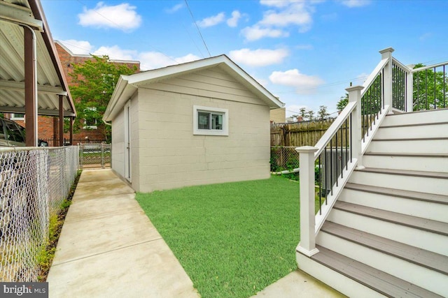 5521 4th St NW, Washington, DC 20011 - view of side of home with stairs, an outbuilding, and concrete block siding