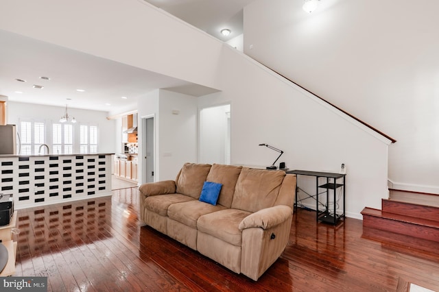 196 Pipers Inn Dr, Fountainville, PA 18923 - living room featuring hardwood / wood-style flooring, a chandelier, and stairs