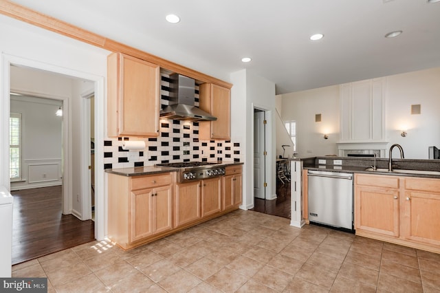 196 Pipers Inn Dr, Fountainville, PA 18923 - kitchen with appliances with stainless steel finishes, wall chimney exhaust hood, light brown cabinets, a sink, and decorative backsplash