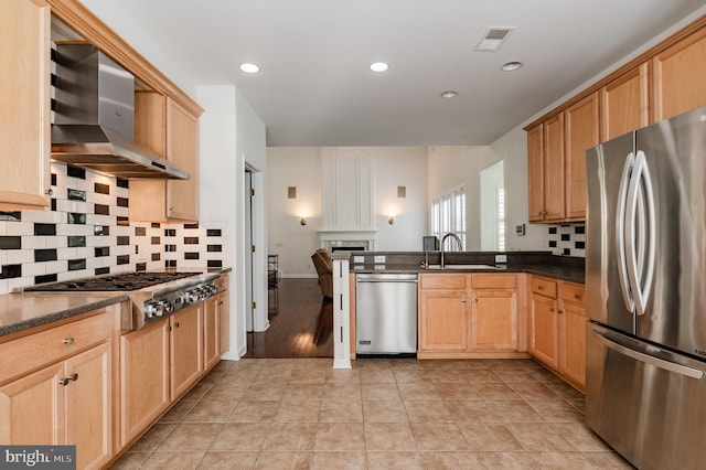 196 Pipers Inn Dr, Fountainville, PA 18923 - kitchen featuring appliances with stainless steel finishes, wall chimney range hood, a sink, tasteful backsplash, and light brown cabinets