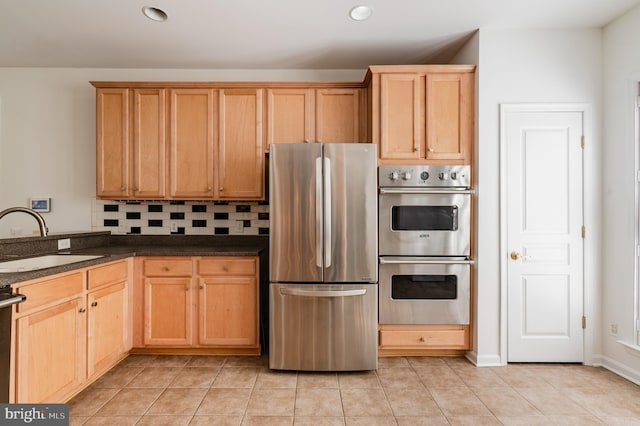196 Pipers Inn Dr, Fountainville, PA 18923 - kitchen featuring appliances with stainless steel finishes, a sink, light tile patterned floors, recessed lighting, and tasteful backsplash