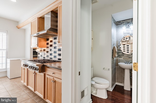 196 Pipers Inn Dr, Fountainville, PA 18923 - kitchen with wall chimney exhaust hood, tasteful backsplash, and plenty of natural light
