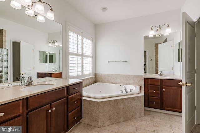 196 Pipers Inn Dr, Fountainville, PA 18923 - bathroom featuring a chandelier, a garden tub, tile patterned flooring, and two vanities