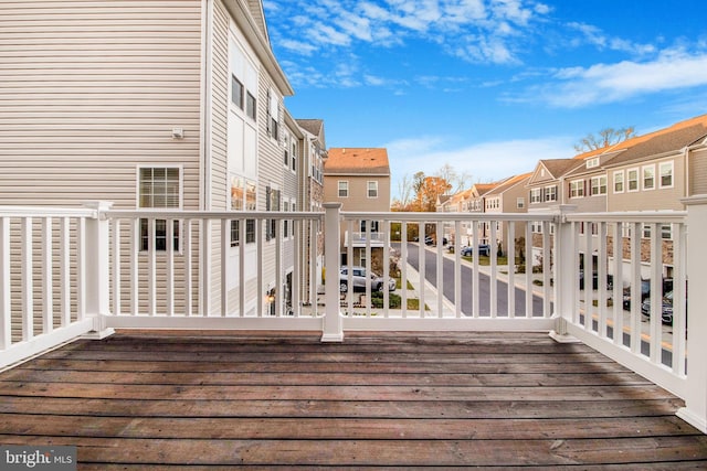 wooden deck with a residential view