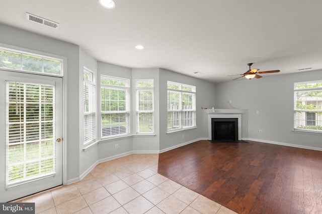 111 Carnoustie, Stephens City, VA 22655 - unfurnished living room featuring a ceiling fan, a fireplace with flush hearth, baseboards, tile patterned floors, and recessed lighting