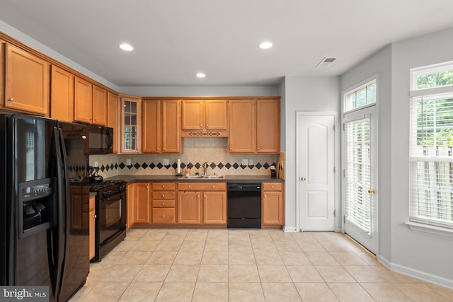 111 Carnoustie, Stephens City, VA 22655 - kitchen with black appliances, a sink, dark countertops, decorative backsplash, and glass insert cabinets