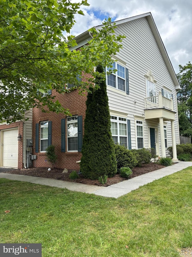 111 Carnoustie, Stephens City, VA 22655 - view of front of property with a front lawn, brick siding, an attached garage, and a balcony