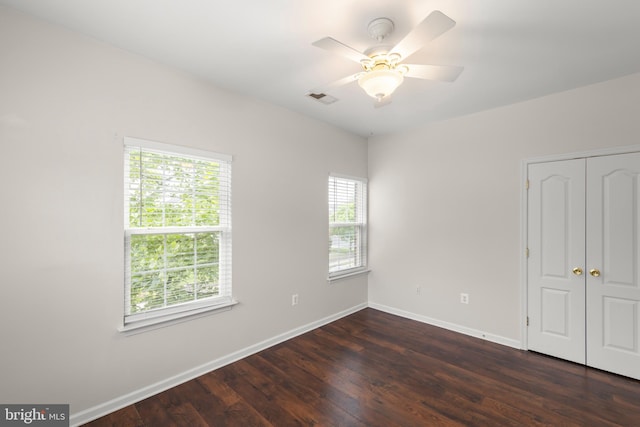 111 Carnoustie, Stephens City, VA 22655 - unfurnished bedroom featuring baseboards, dark wood-style flooring, a closet, and a ceiling fan
