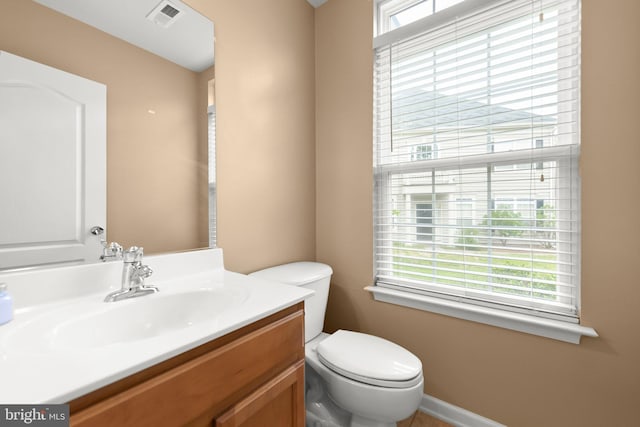111 Carnoustie, Stephens City, VA 22655 - bathroom featuring plenty of natural light, toilet, vanity, and baseboards