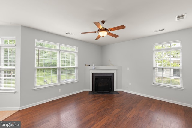 111 Carnoustie, Stephens City, VA 22655 - unfurnished living room featuring a fireplace with flush hearth, a ceiling fan, wood finished floors, and baseboards