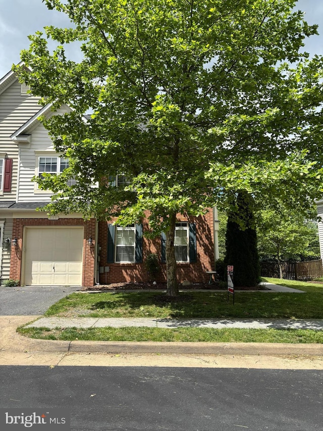 111 Carnoustie, Stephens City, VA 22655 - view of property hidden behind natural elements featuring an attached garage, brick siding, and asphalt driveway