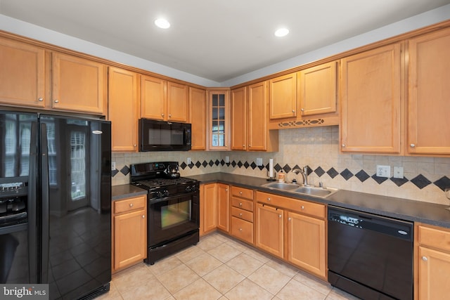 111 Carnoustie, Stephens City, VA 22655 - kitchen featuring black appliances, a sink, dark countertops, light tile patterned flooring, and tasteful backsplash