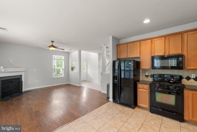 111 Carnoustie, Stephens City, VA 22655 - kitchen with black appliances, dark countertops, open floor plan, ceiling fan, and recessed lighting