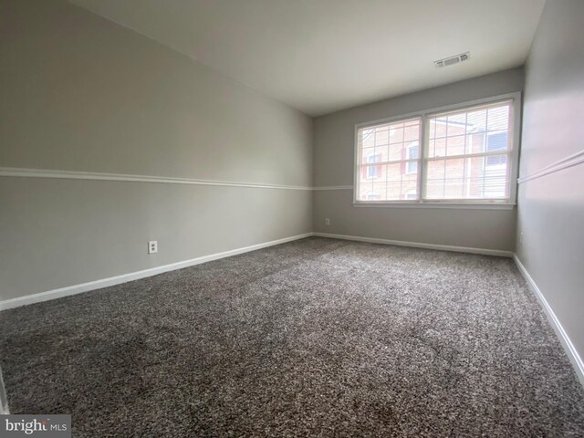 12625 Kempston Ln, Woodbridge, VA 22192 - carpeted empty room with baseboards