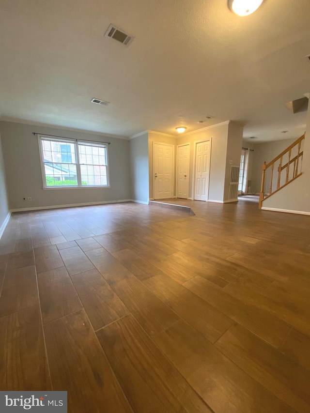 12625 Kempston Ln, Woodbridge, VA 22192 - unfurnished living room featuring baseboards, crown molding, wood finished floors, and stairs