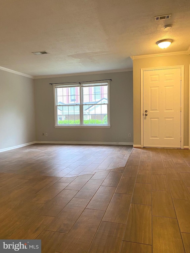 12625 Kempston Ln, Woodbridge, VA 22192 - spare room featuring crown molding, wood finished floors, baseboards, and a textured ceiling