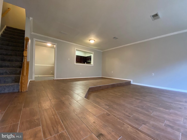 12625 Kempston Ln, Woodbridge, VA 22192 - empty room with ornamental molding, stairs, wood finished floors, and baseboards