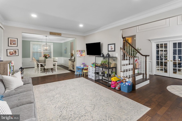 13 Richland Dr, Mount Laurel, NJ 08054 - living room featuring french doors, dark wood-type flooring, crown molding, stairs, and a wainscoted wall