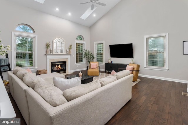 13 Richland Dr, Mount Laurel, NJ 08054 - living area featuring high vaulted ceiling, ceiling fan, a glass covered fireplace, baseboards, and dark wood-style flooring