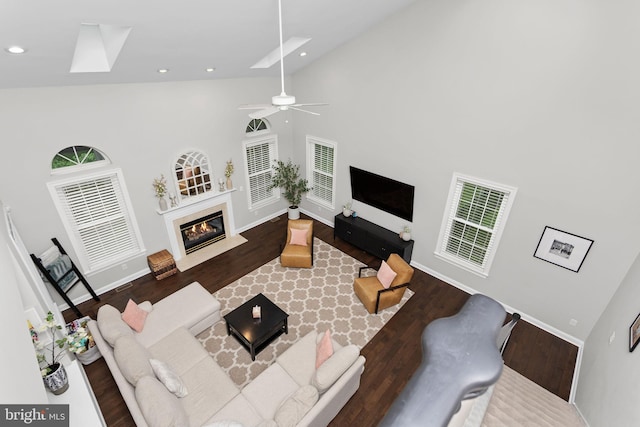 13 Richland Dr, Mount Laurel, NJ 08054 - living area with a skylight, high vaulted ceiling, wood finished floors, ceiling fan, and baseboards