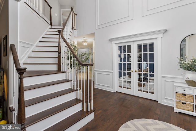 13 Richland Dr, Mount Laurel, NJ 08054 - staircase with french doors, wood finished floors, a decorative wall, and a wainscoted wall
