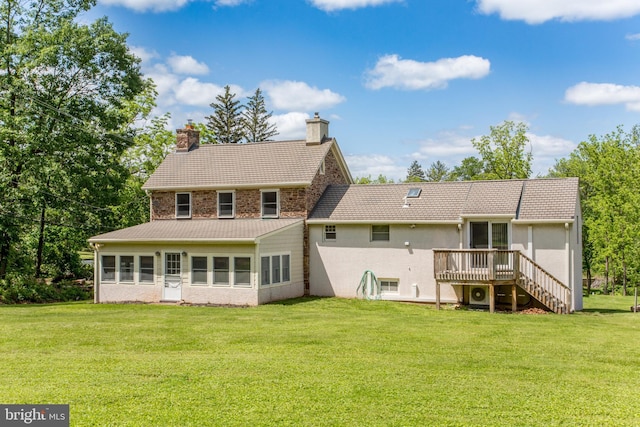 577 Sackettsford Rd, Warminster, PA 18974 - rear view of house with a chimney, a wooden deck, a lawn, and stairs