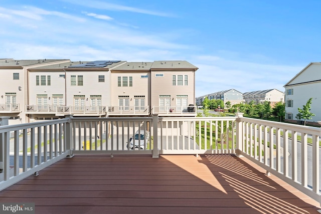 wooden deck featuring a residential view