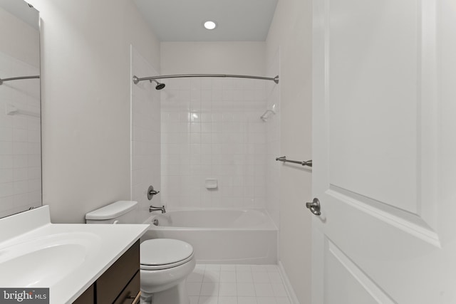 bathroom with toilet, tile patterned flooring, vanity, and  shower combination