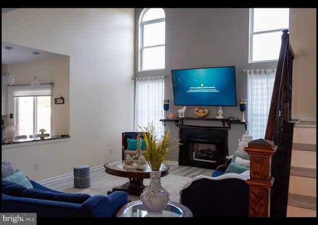 821 Streamview Ln, Vineland, NJ 08360 - living room with a fireplace, wood finished floors, plenty of natural light, and a high ceiling