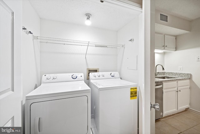 1525 Lincoln Way Unit 203, Mclean, VA 22102 - laundry room with independent washer and dryer, light tile patterned floors, and a textured ceiling