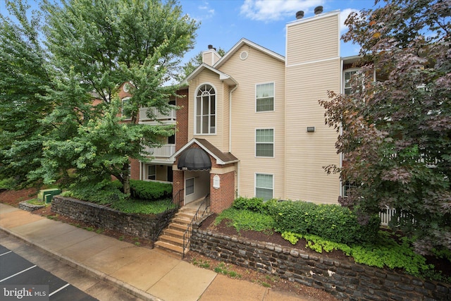 1525 Lincoln Way Unit 203, Mclean, VA 22102 - view of property featuring a chimney
