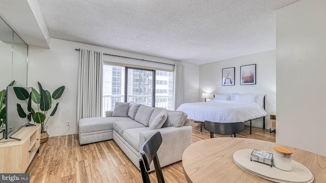 3101 Boardwalk Unit 1206-2, Atlantic City, NJ 08401 - bedroom featuring a textured ceiling and light wood finished floors