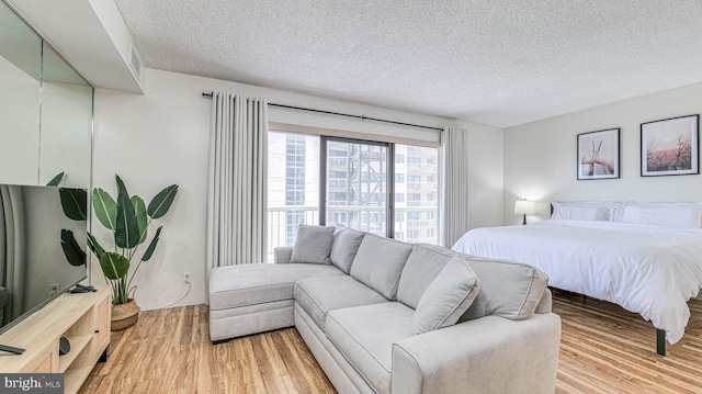 3101 Boardwalk Unit 1206-2, Atlantic City, NJ 08401 - bedroom with a textured ceiling and light wood-style flooring