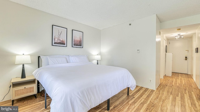 3101 Boardwalk Unit 1206-2, Atlantic City, NJ 08401 - bedroom featuring light wood finished floors and a textured ceiling