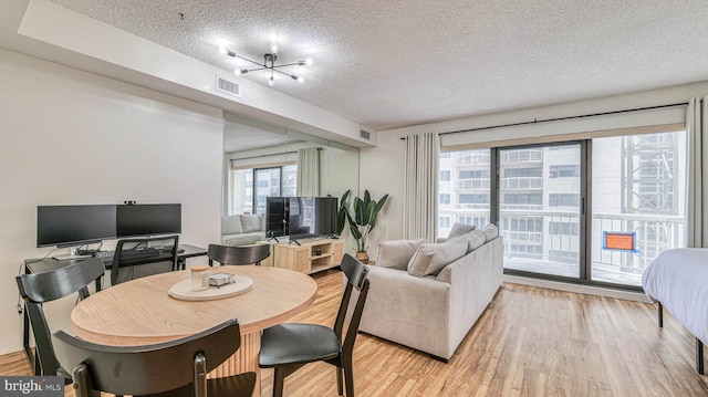 3101 Boardwalk Unit 1206-2, Atlantic City, NJ 08401 - dining room with a textured ceiling and light wood finished floors