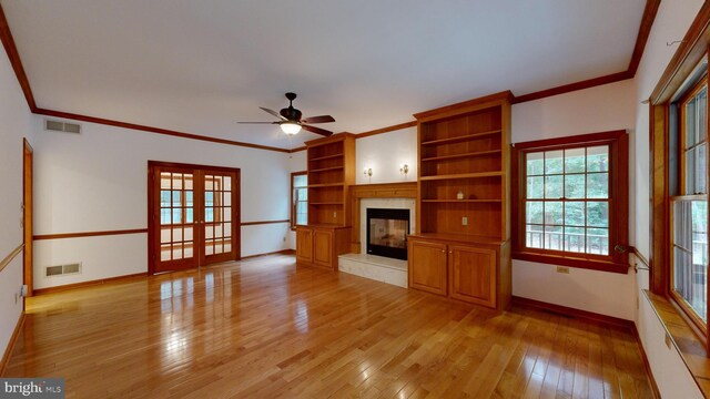 30751 Al Jan Dr, Laurel, DE 19956 - unfurnished living room featuring baseboards, ceiling fan, light wood-style flooring, crown molding, and a premium fireplace