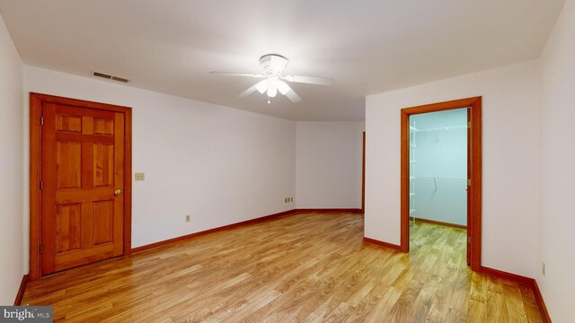 30751 Al Jan Dr, Laurel, DE 19956 - unfurnished room featuring light wood finished floors, ceiling fan, and baseboards