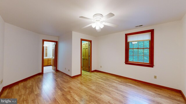 30751 Al Jan Dr, Laurel, DE 19956 - unfurnished room with light wood-type flooring, a ceiling fan, and baseboards