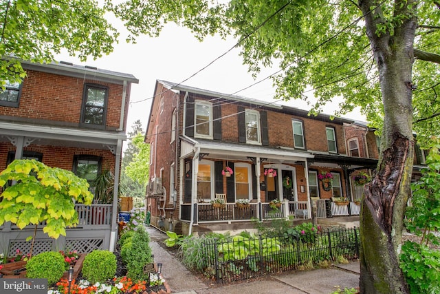 256 N Union St, Lambertville, NJ 08530 - view of front facade featuring a porch and brick siding
