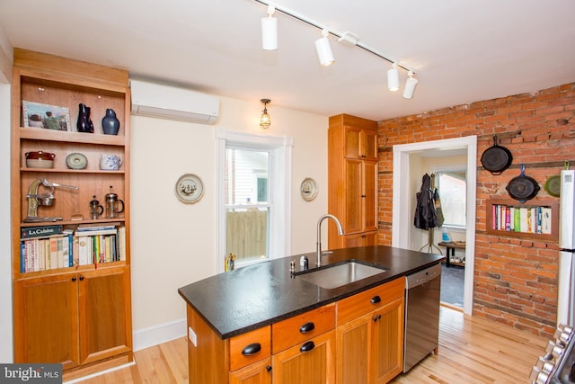 256 N Union St, Lambertville, NJ 08530 - kitchen with a sink, stainless steel dishwasher, brick wall, an AC wall unit, and light wood-style floors