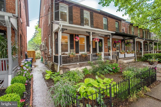 256 N Union St, Lambertville, NJ 08530 - view of property with brick siding and a porch