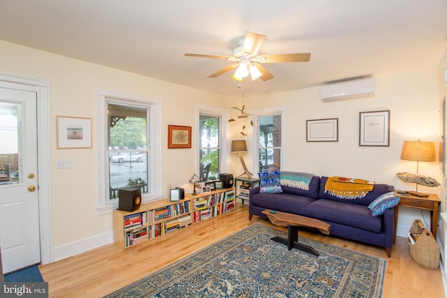 256 N Union St, Lambertville, NJ 08530 - living room featuring a wall mounted air conditioner, wood finished floors, ceiling fan, and baseboards