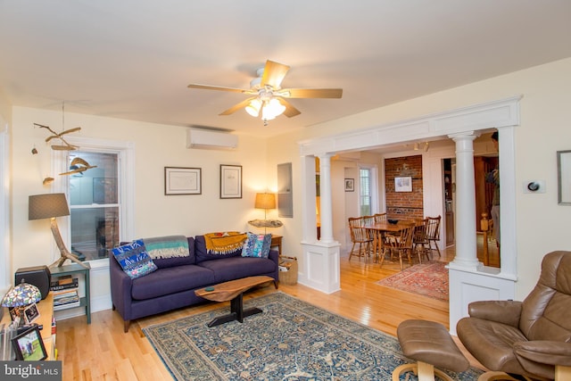 256 N Union St, Lambertville, NJ 08530 - living area with ornate columns, light wood finished floors, a wall unit AC, and ceiling fan