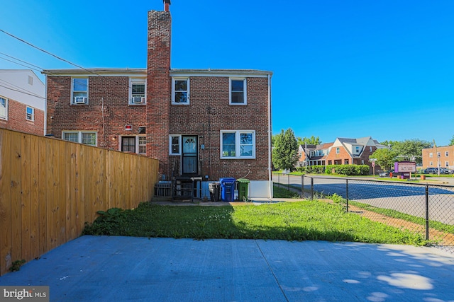 3958 Oakford Ave, Baltimore, MD 21215 - back of house featuring a chimney, brick siding, and a residential view