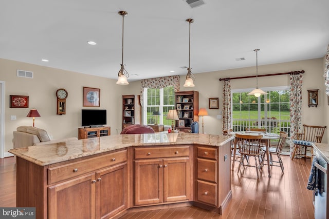 152 Independence Way, Mechanicsburg, PA 17050 - kitchen with open floor plan, plenty of natural light, light stone countertops, wood finished floors, and recessed lighting