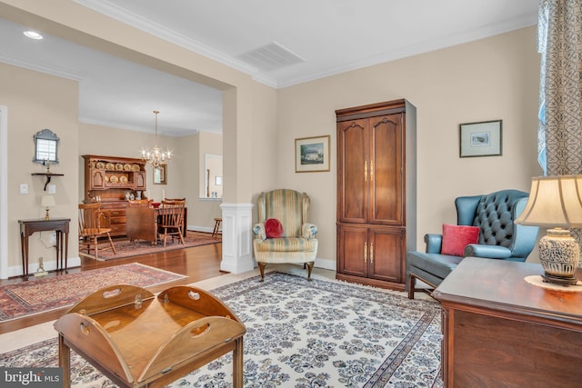152 Independence Way, Mechanicsburg, PA 17050 - living area with a chandelier, wood finished floors, crown molding, and baseboards