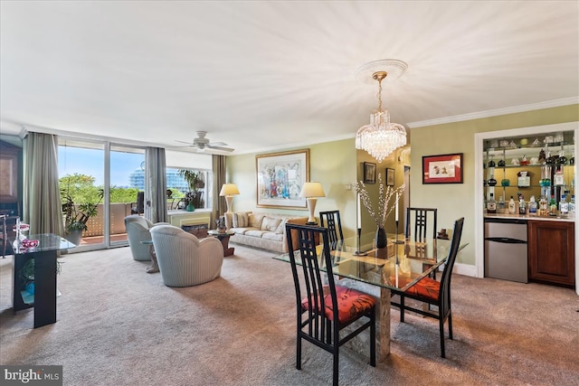 430 M St SW Unit N-609, Washington, DC 20024 - dining room featuring light carpet, a chandelier, crown molding, and a ceiling fan