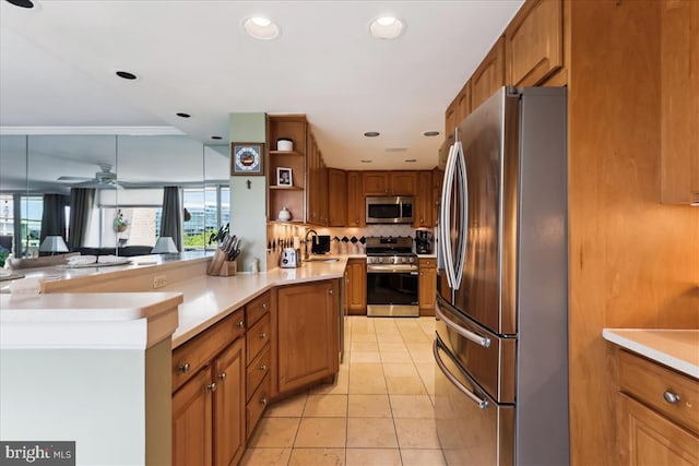430 M St SW Unit N-609, Washington, DC 20024 - kitchen with appliances with stainless steel finishes, brown cabinetry, open shelves, plenty of natural light, and recessed lighting
